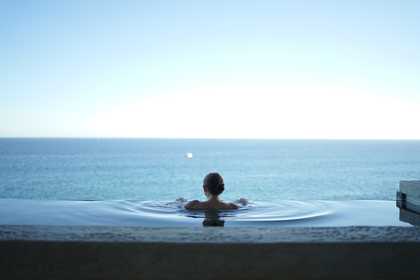 An infinity pool and a woman